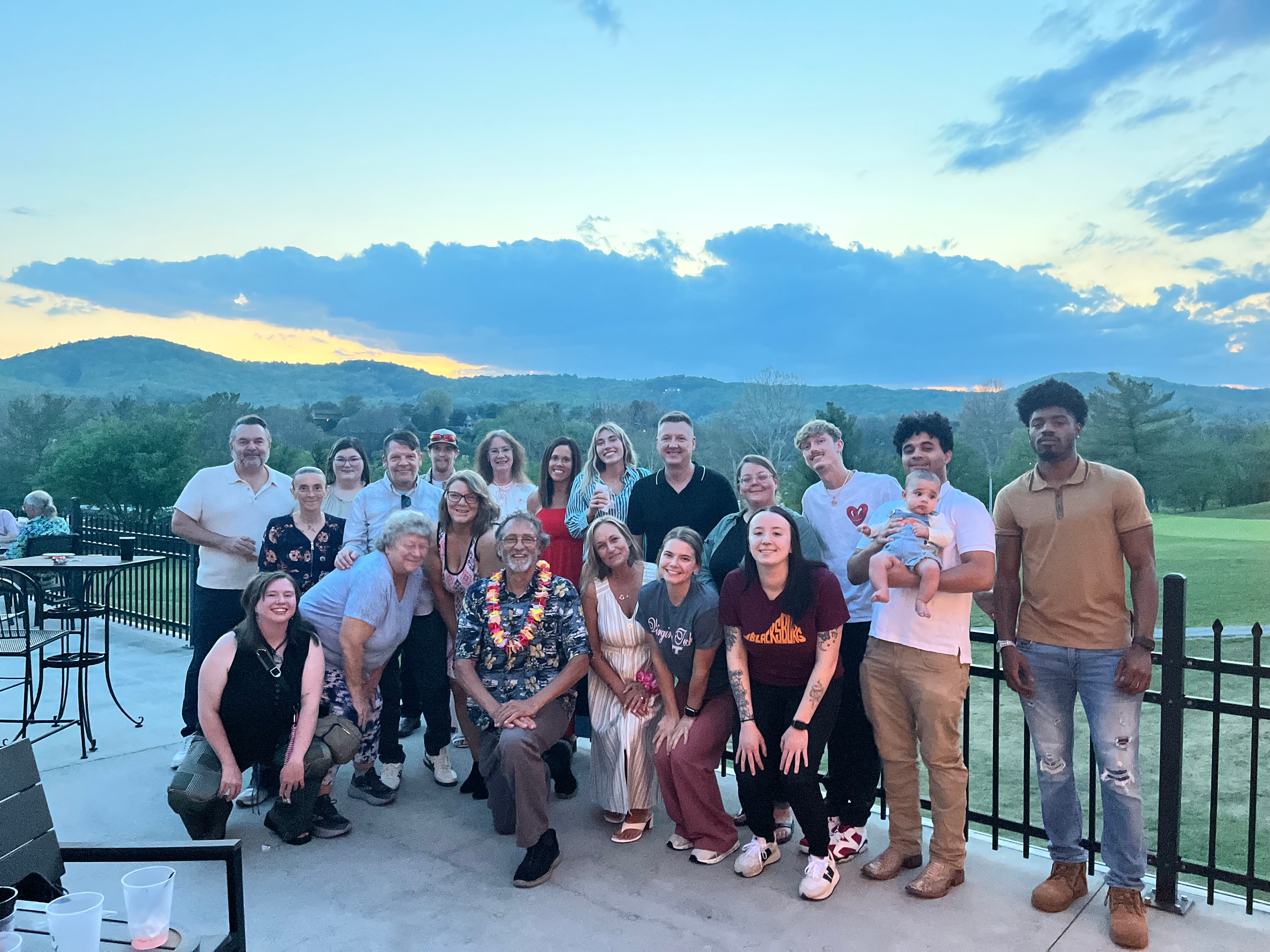 Team gathering at sunset